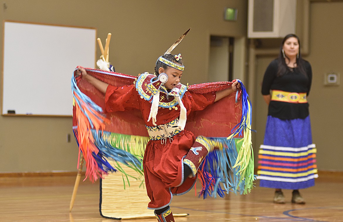 Talcee Vandenberg performs a fancy dance Thursday morning at Olney-Bissell School during a presentation by the Pikuni Legacy Dance Troupe from Browning. (Heidi Desch/Whitefish Pilot)