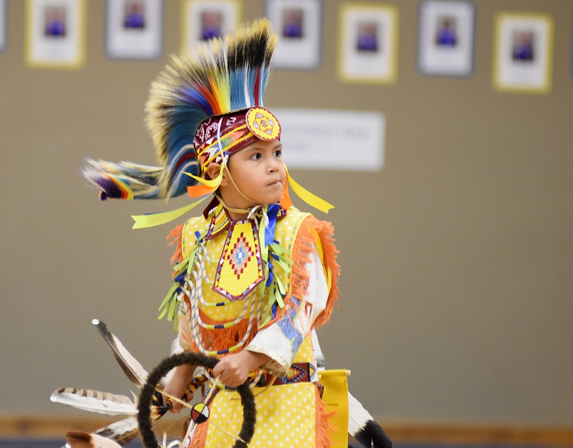 Klay St. Goddard performs the chicken dance Thursday morning at Olney-Bissell School during a presentation by the Pikuni Legacy Dance Troupe from Browning. (Heidi Desch/Whitefish Pilot)