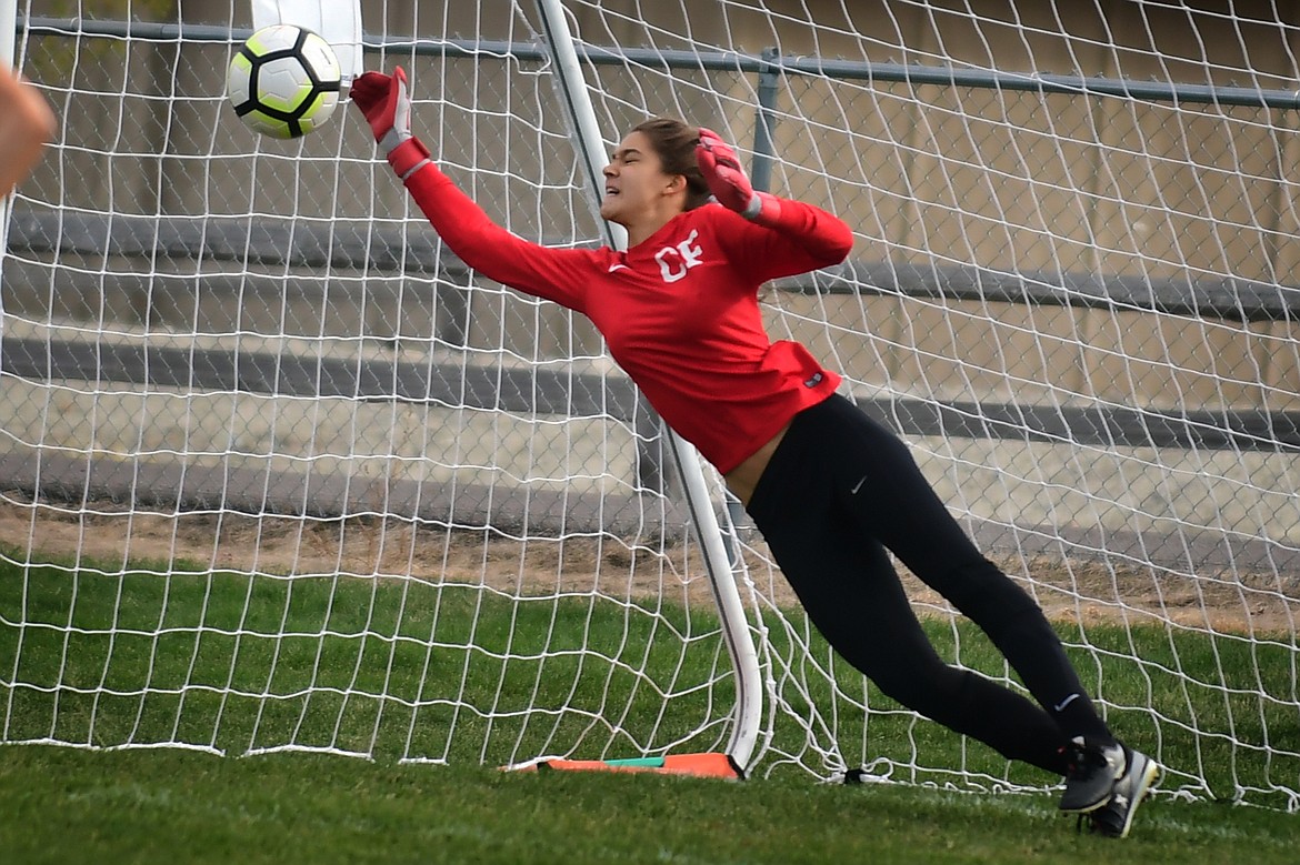 Ave McDonald makes a key save on a penalty kick in the second half at Whitefish Thursday. (Jeremy Weber photo)