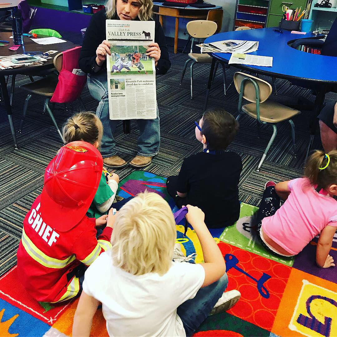 Reporter Erin Jusseaume explains to one group about the exciting job she has and how much fun it is going to a Horsemen game to take photos to go into the paper. (Photo provided)