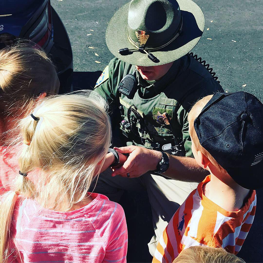 MHP Trooper Zach Rehbein was voted Best Career Station by some of the kids as they got to sit in his patrol car, and they thought that was the best fun they had on the day. (Photo provided)