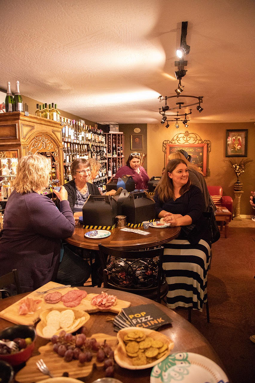 Photo by SUE WILSON
Wine walk attendees enjoyed a sit down at Heart Rock WInes/Crosstime Saloon.