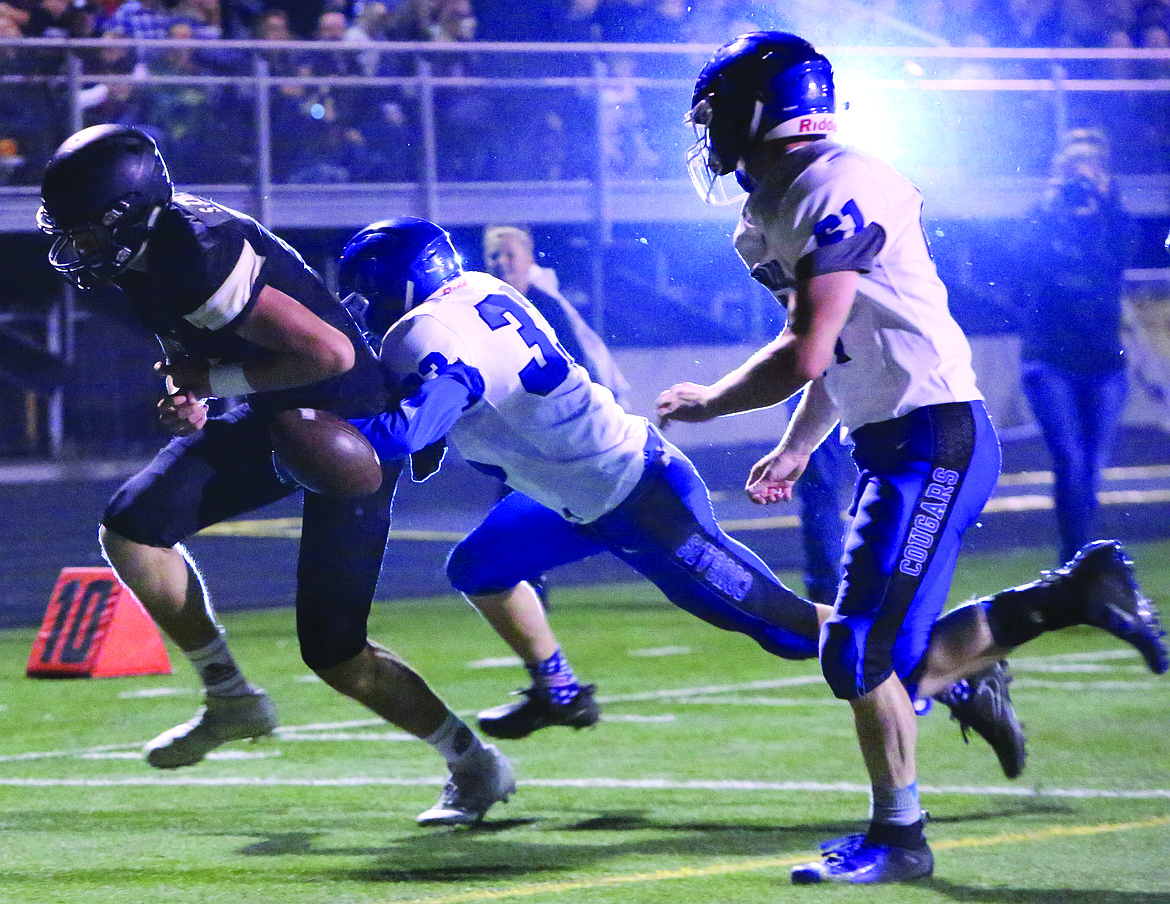 Connor Vanderweyst/Sun Tribune - Warden defensive back Tyson Wall (33) forces Royal quarterback Sawyer Jenks to fumble.