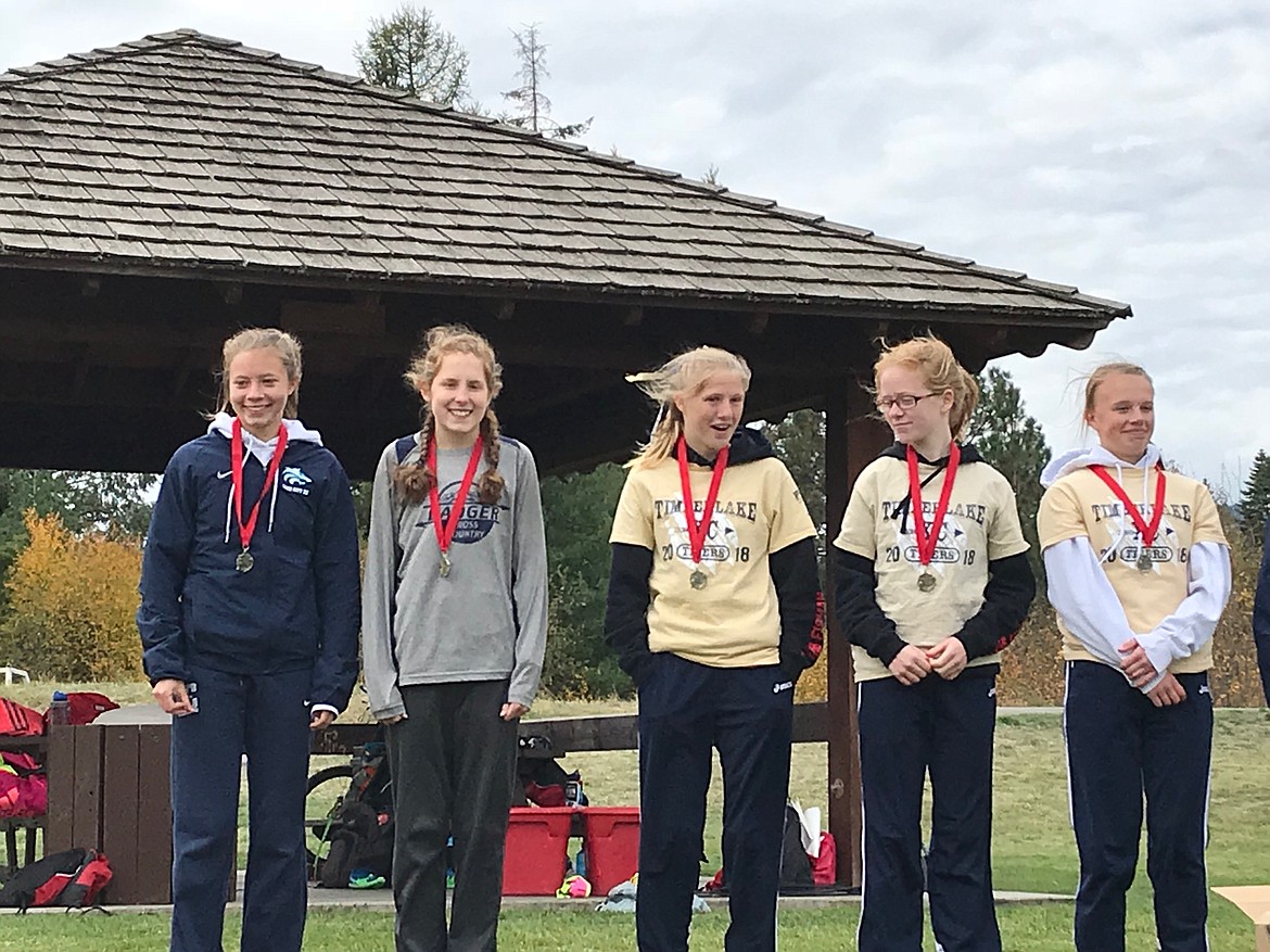 Photo by TYLER WARNER
Abby Gorton recieving a medal after the William Johnson Sandpoint Invitational.