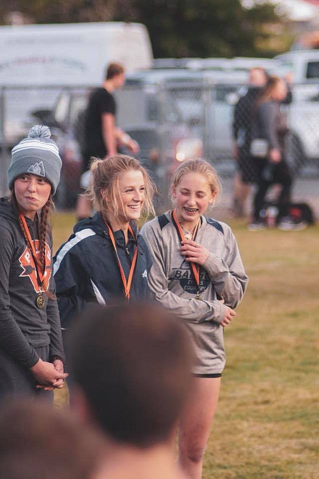 Photo by LEVI BONNELL
Madi McIntyre and Camille Ussher recieving medals after the Priest River race.