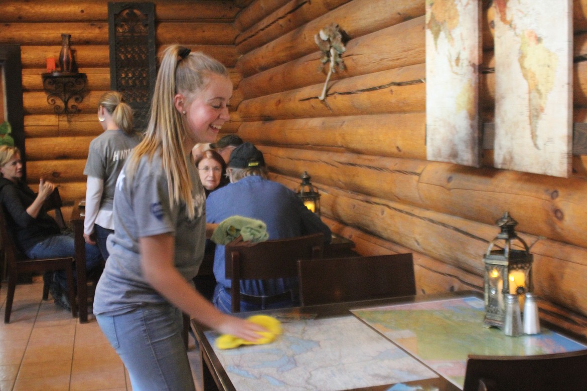 Photo by TANNA YEOUMANS
&#147;I like the feeling I get when I can help a lot of people because I get to see their reactions and they are just really happy,&#148; said Maggie Bateman, while wiping down tables.