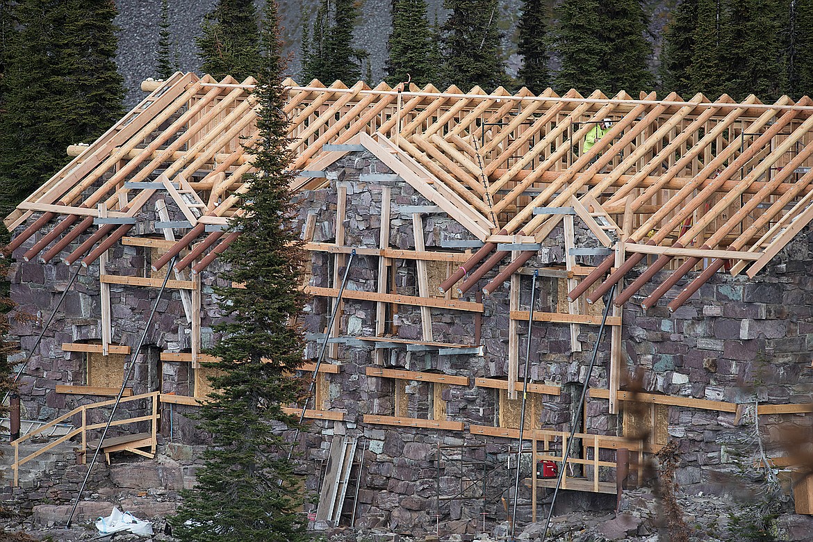 An employee works on the Sperry Chalet last week.