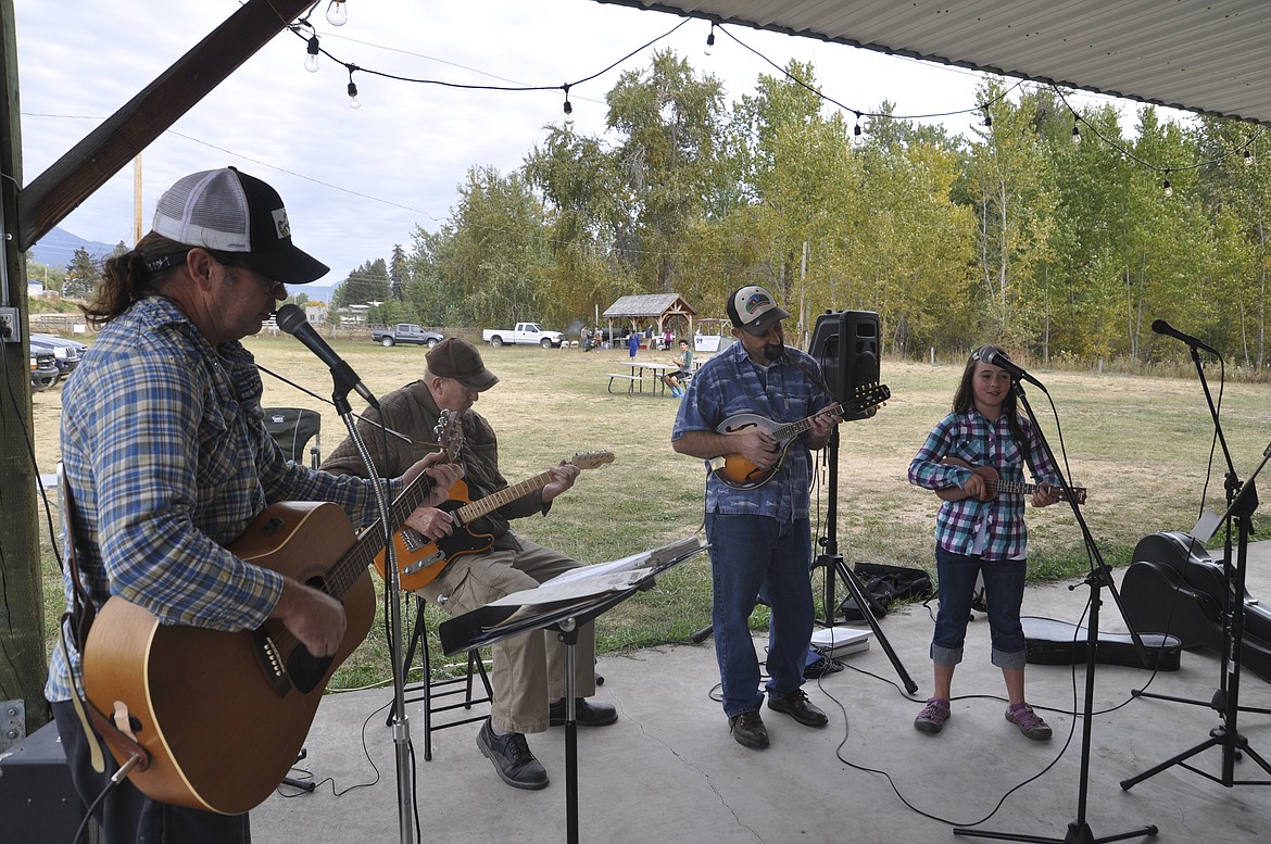 The Rock Pickers provided entertainment at the first Garlic Fest in St. Ignatius last week. Pictured left to right are Tim Krantz, Tony Mathis, Lyle Cronk and Amelia Cronk. (Ashley Fox/Lake County Leader)