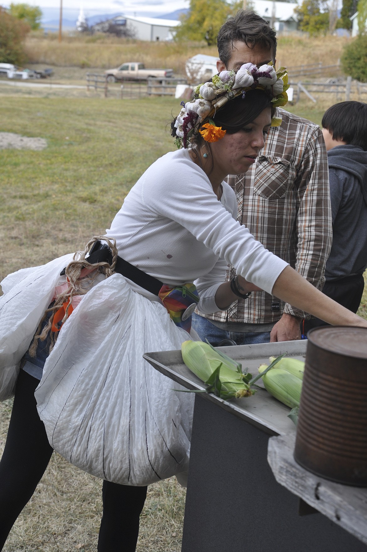 Rose Bear Don&#146;t Walk, manager of the Mission Falls Farmer&#146;s Market, adds corn to the grill during a garlic festival. (Ashley Fox/Lake County Leader)