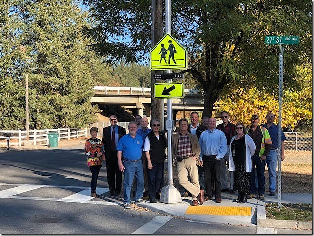 Rotarians from three clubs in Coeur d&#146;Alene raised funds to improve safety at a crosswalk near Fernan STEM Academy. They dedicated the crosswalk on Tuesday. Pictured, l to r: Shelly Webb, Phil Anderson, Sid Smith, Ben Holzhauser, Scott Jones, Karen Cook, Chris Guggemos, Todd Feusier, Brian Goetz, Jim Addis, Bob Thiessen, Fernan STEM Academy Principal Kathy Livingston, Robert Royce, and Dave Gibbs. (Courtesy)
