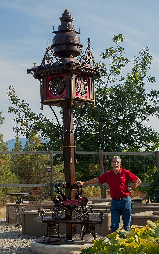 Artist David Dose, of Pinehurst, stands with his most recent large-scale scrap sculpture, &#147;Victory Tower,&#148; during a recent visit to the owner&#146;s house on the outskirts of Coeur d&#146;Alene. This is Dose&#146;s first big piece after a 20-year break to work as an instructor and raise his family.

Photo by KELSEY WOOD