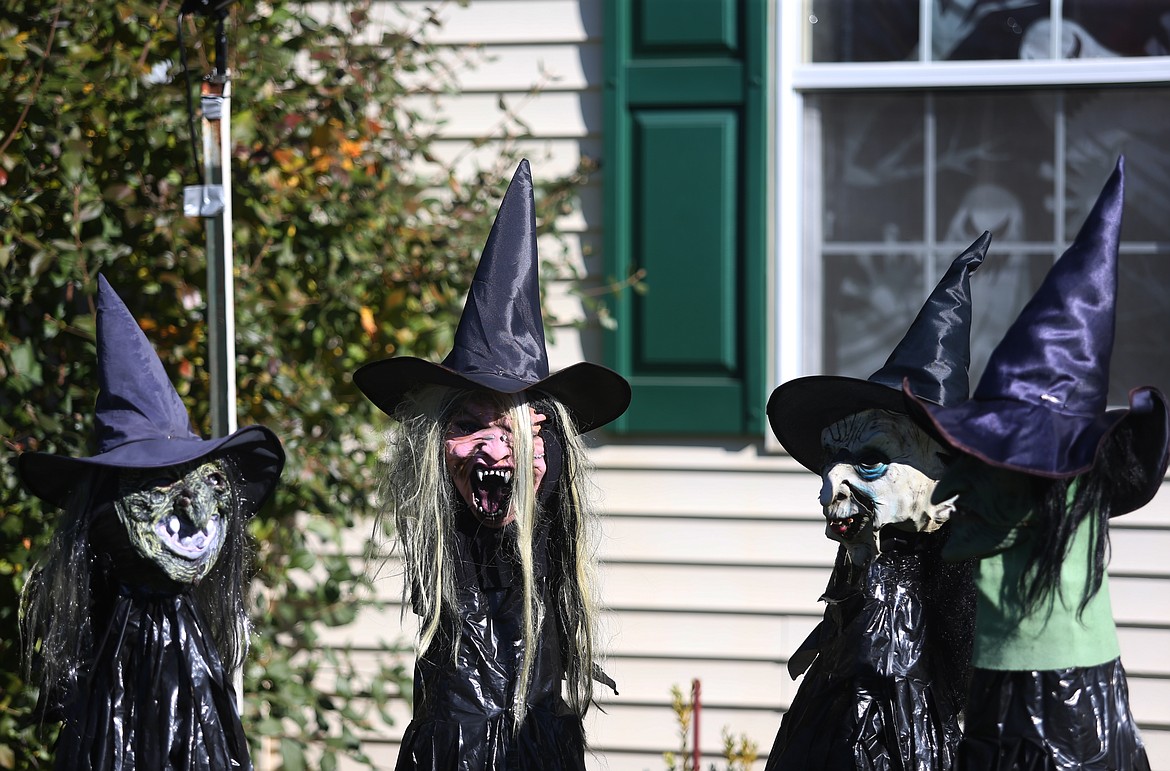 Four Halloween-themed witches devise plans to scare trick-or-treaters at a house on West Wilbur Avenue in Coeur d'Alene. (LOREN BENOIT/Press)
