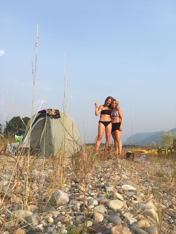 Karen Wilmoth, left, and Chelsea Dickinson set up camp on a secluded beach on Lake Pend Oreille.