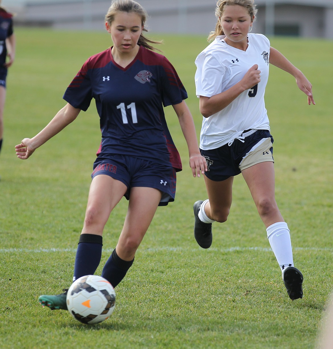 MARK NELKE/Press
Isabella Lucky (11) of Coeur d&#146;Alene Charter Academy controls the ball as Alexis Barry of Timberlake closes during Saturday&#146;s 3A District 1-2 girls soccer championship game at Sunrise Rotary Field in Rathdrum.