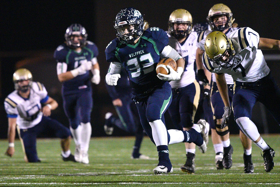 Glacier running back Preston Blain (33) heads to the end zone on a 46-yard touchdown run in the second quarter against Missoula Big Sky at Legends Stadium on Thursday. (Casey Kreider/Daily Inter Lake)