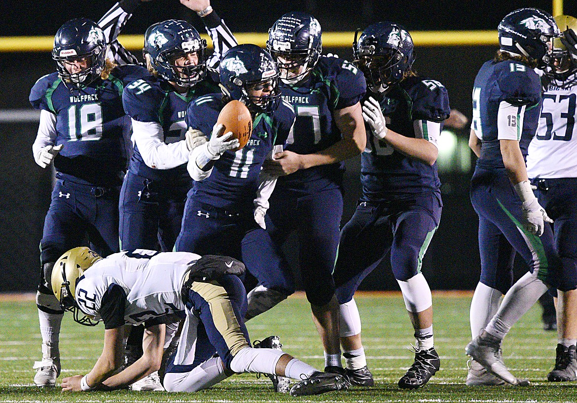 Glacier defensive back Gator Mostek (11) celebrates with teammates after recovering a third-quarter fumble against Missoula Big Sky at Legends Stadium on Thursday. (Casey Kreider/Daily Inter Lake)