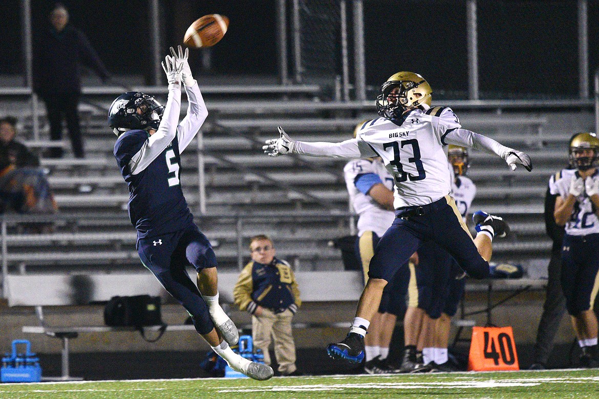 Glacier wide receiver Drew Deck (5) hauls in a reception along the sideline over Missoula Big Sky defender Dayton Evans at Legends Stadium on Thursday. Deck would fumble on the play and turn the ball over to Big Sky. (Casey Kreider/Daily Inter Lake)