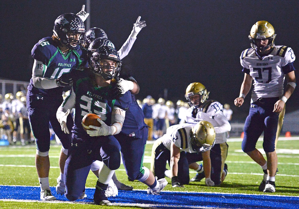 Glacier running back Preston Blain (33) celebrates in the end zone with teammates after a third-quarter touchdown run against Missoula Big Sky at Legends Stadium on Thursday. (Casey Kreider/Daily Inter Lake)