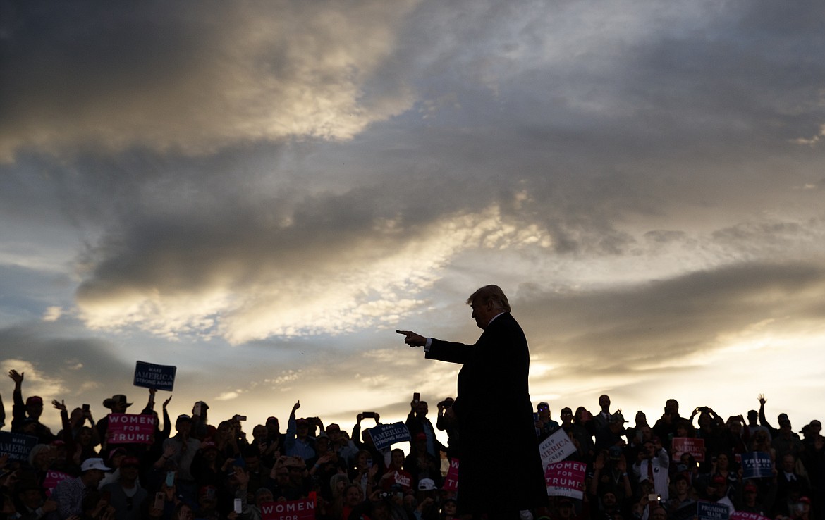 President Donald Trump arrives as the sun sets to speak at a campaign rally at Minuteman Aviation Hangar, Thursday, Oct. 18, 2018, in Missoula, Mont. (AP Photo/Carolyn Kaster)