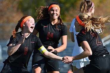Flathead's Skyleigh Thompson, left, Mathilde Burgaard, center, and Elena Jimenez, right, celebrate after Jimenez' goal in the second half against Helena High at Legends Stadium on Thursday. (Casey Kreider/Daily Inter Lake)