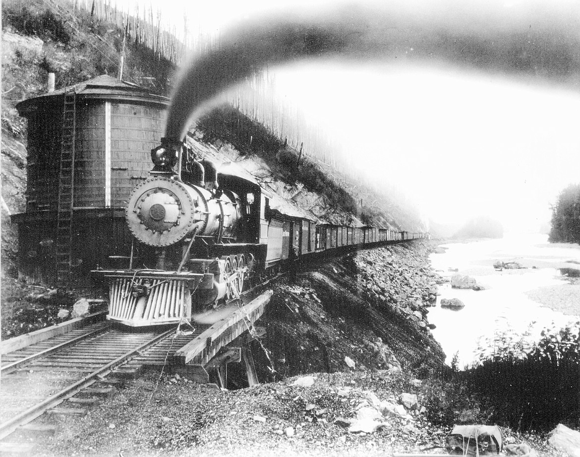 A Great Northern Railroad steam engine chugs along the Middle Fork.