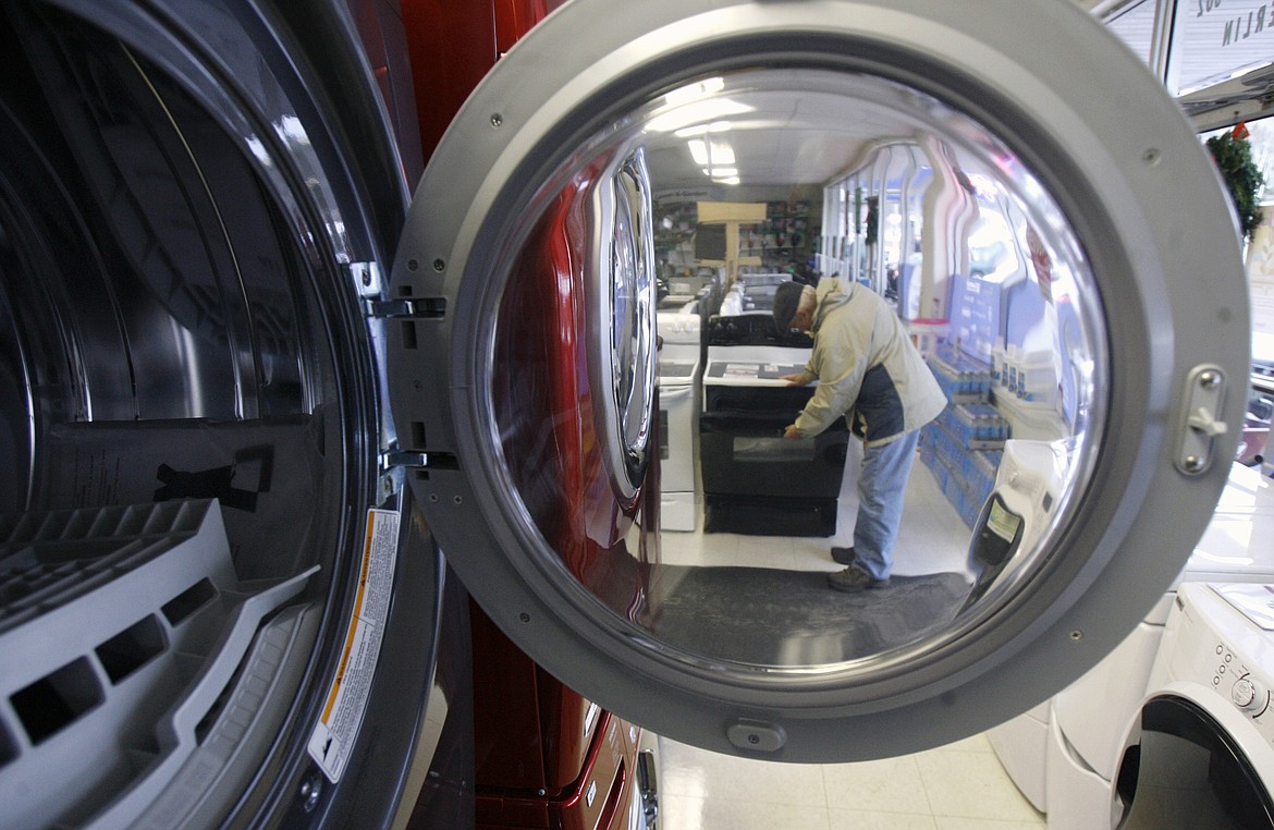 FILE- In this Nov. 29, 2007, file photo a person shops at the Sears Hometown store in Berlin, Vt. (AP Photo/Toby Talbot, File)