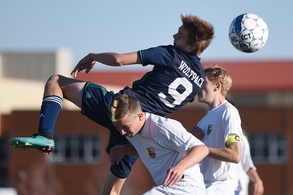 Glacier's Daniel Camp (9) battles for a header off a corner kick against Missoula Big Sky at Glacier High School on Tuesday. (Casey Kreider/Daily Inter Lake)