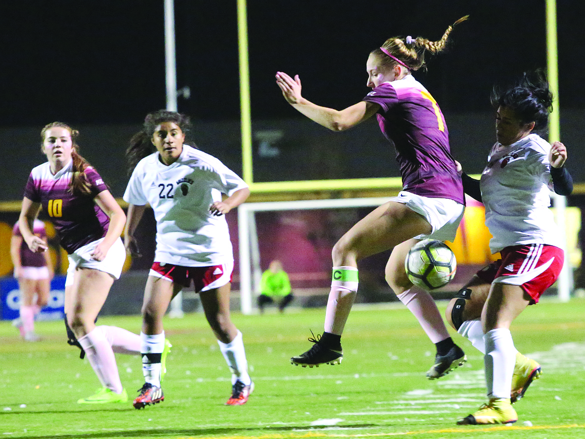 Connor Vanderweyst/Columbia Basin Herald
Moses Lake captain Denali Knowles tries to gain control of the ball against Sunnyside.