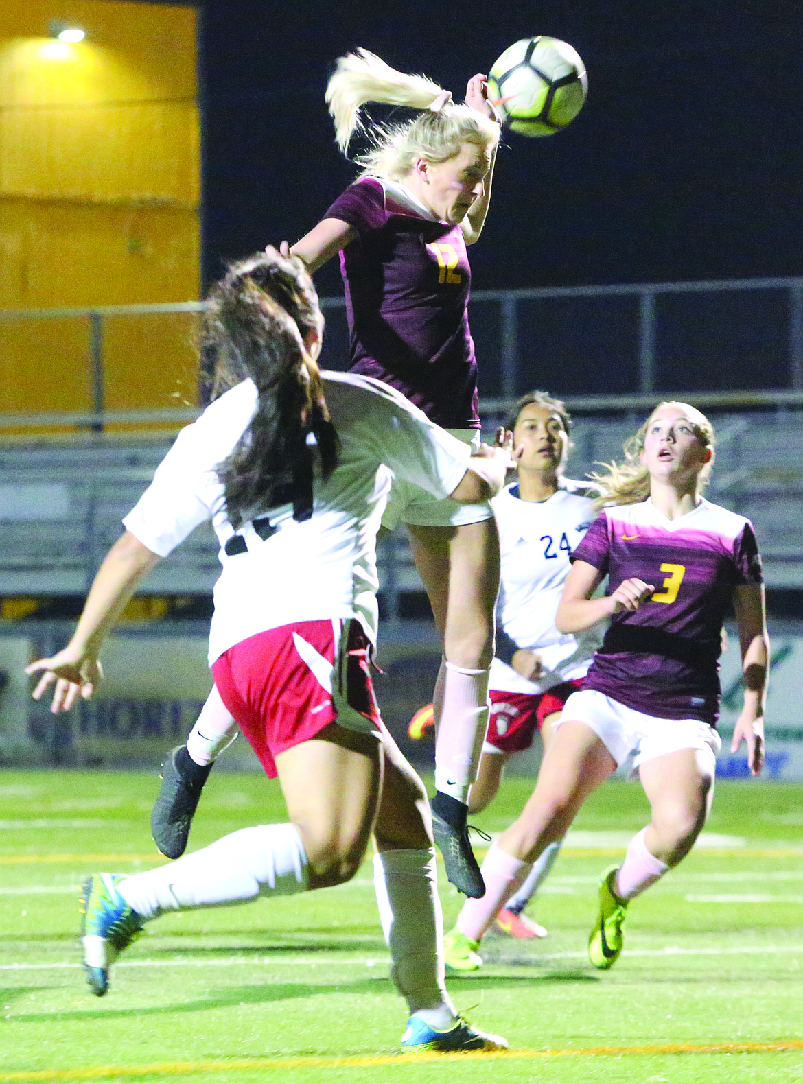 Connor Vanderweyst/Columbia Basin Herald
Moses Lake senior Morgan Skone leaps for a header against Sunnyside.