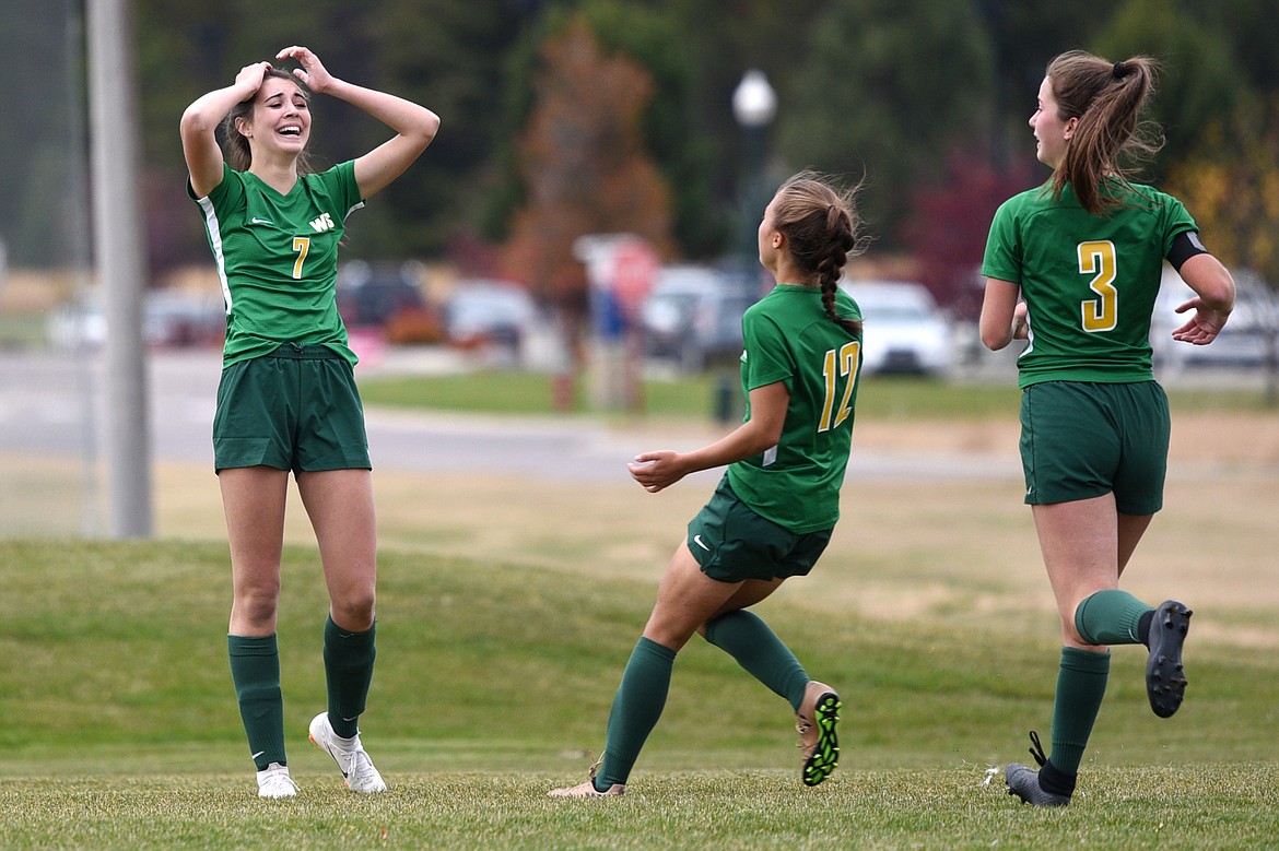 Whitefish's Olivia Potthoff (7) celebrates with teammates Anna Cook (12) and Grace Benkelman (3) after Potthoff scored the game-winning goal in overtime against Hamilton at Smith Fields in Whitefish on Saturday. (Casey Kreider/Daily Inter Lake)