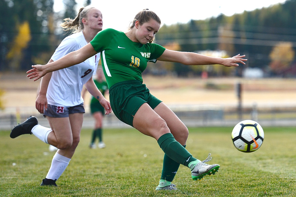 Whitefish's Ali Hirsch (10) centers a ball in the first half against Hamilton at Smith Fields in Whitefish on Saturday. (Casey Kreider/Daily Inter Lake)