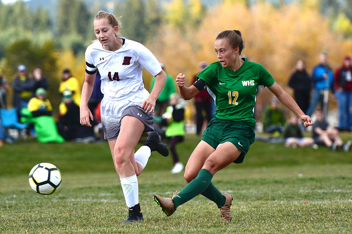 Whitefish's Anna Cook (12) scores a second-half goal against Hamilton that would tie the score at 1-1 and send the game into overtime at Smith Fields in Whitefish on Saturday. (Casey Kreider/Daily Inter Lake)