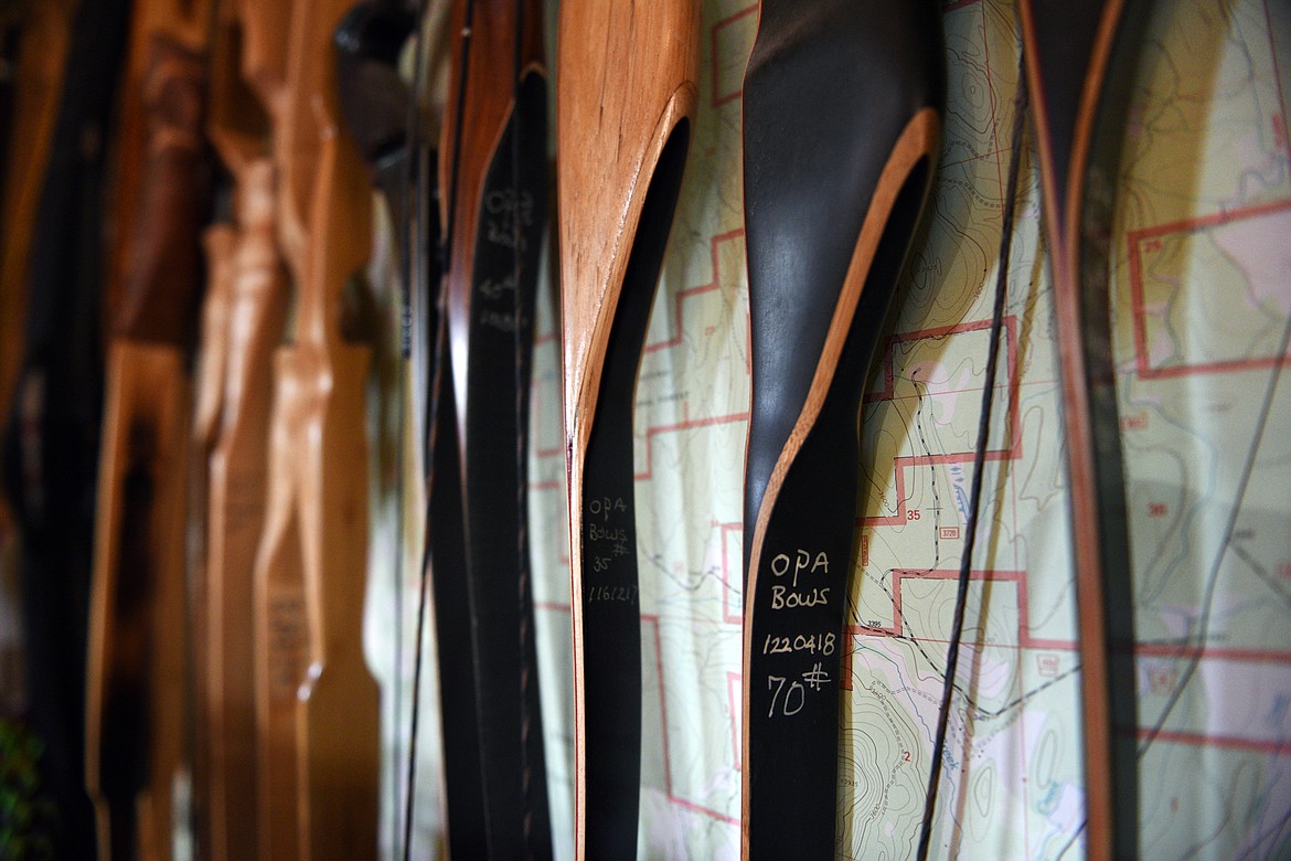 Finished bows hang from a wall in Peter Laffin&#146;s workshop in Eureka on Sept. 26.