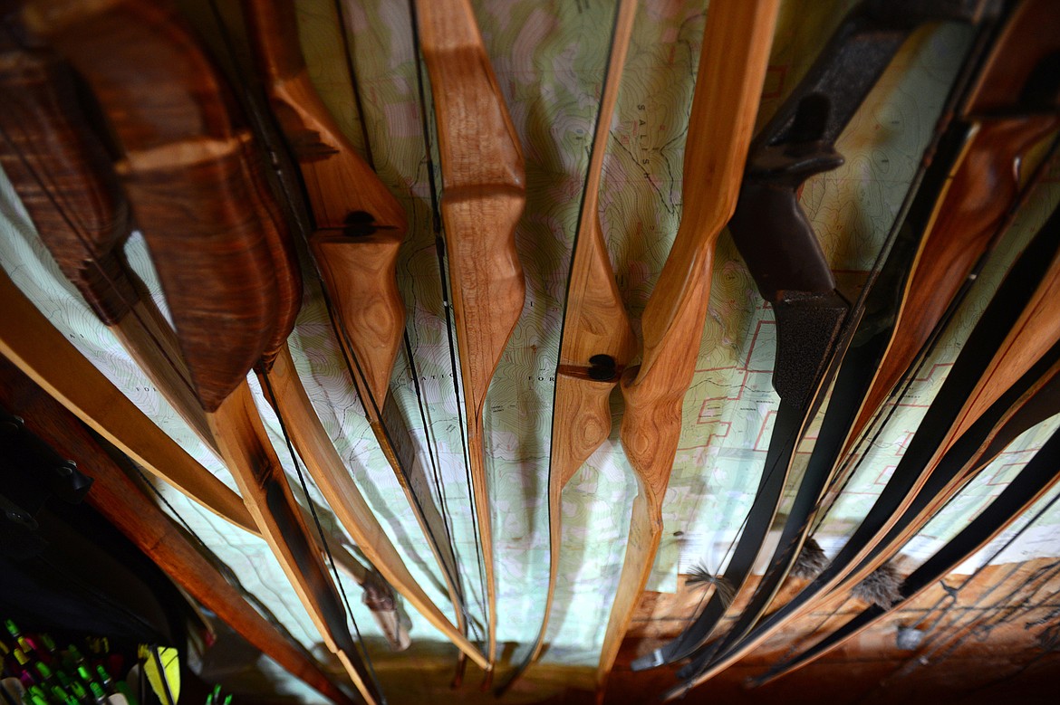 Finished bows hang from a wall in Peter Laffin&#146;s workshop in Eureka on Sept. 26. (Casey Kreider/Daily Inter Lake)