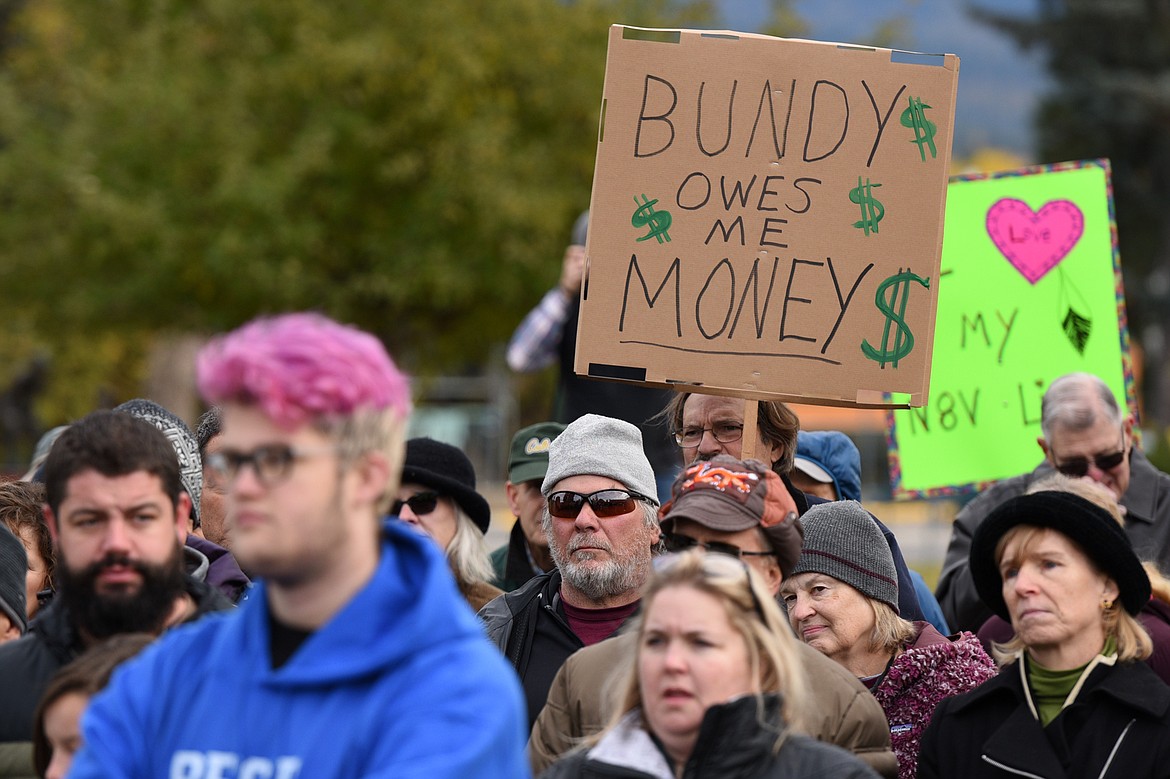 Attendees hold signs at Montana Undivided: A Rally for Human Rights and Public Lands at Depot Park in Whitefish on Saturday. (Casey Kreider/Daily Inter Lake)