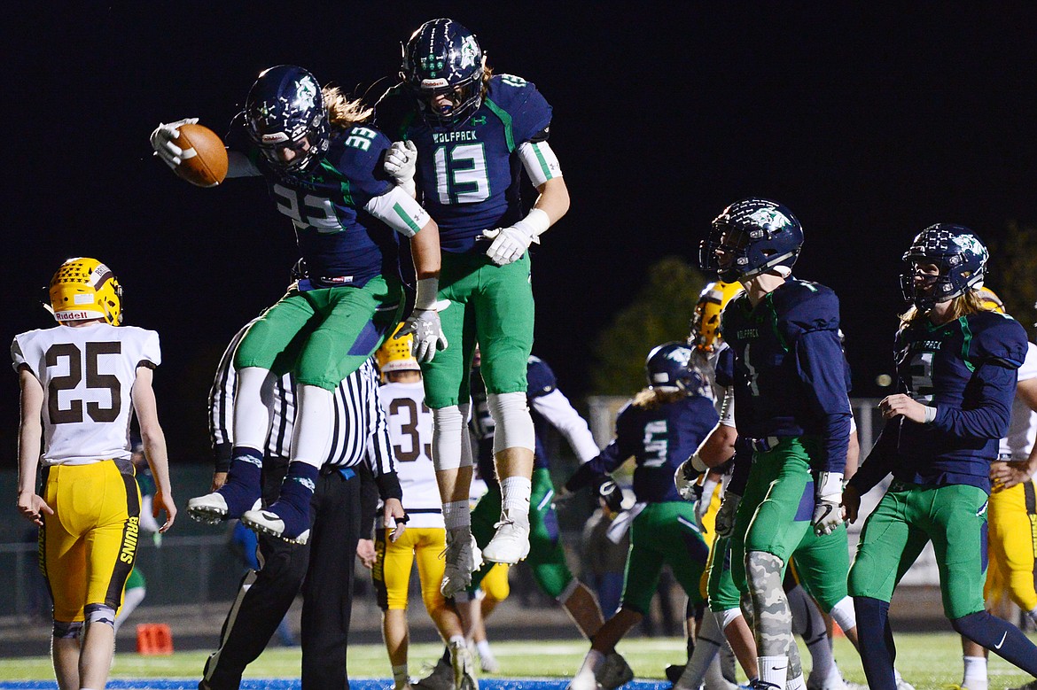 Glacier running back Preston Blain (33) and tight end Cole Crosby (13) celebrate after Blain's second-quarter touchdown run against Helena Capital at Legends Stadium on Friday. (Casey Kreider/Daily Inter Lake)