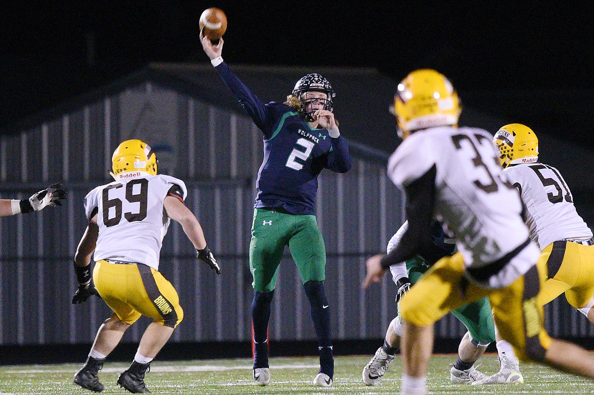 Glacier quarterback Evan Todd (2) completes a pass downfield to wide receiver Drew Deck (5) in the third quarter against Helena Capital at Legends Stadium on Friday. (Casey Kreider/Daily Inter Lake)