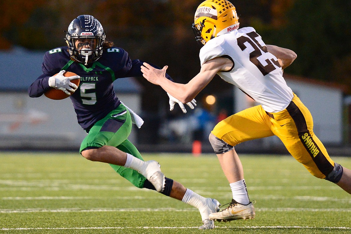 Glacier wide receiver Drew Deck (5) looks for room to run after a first-quarter reception against Helena Capital at Legends Stadium on Friday. (Casey Kreider/Daily Inter Lake)