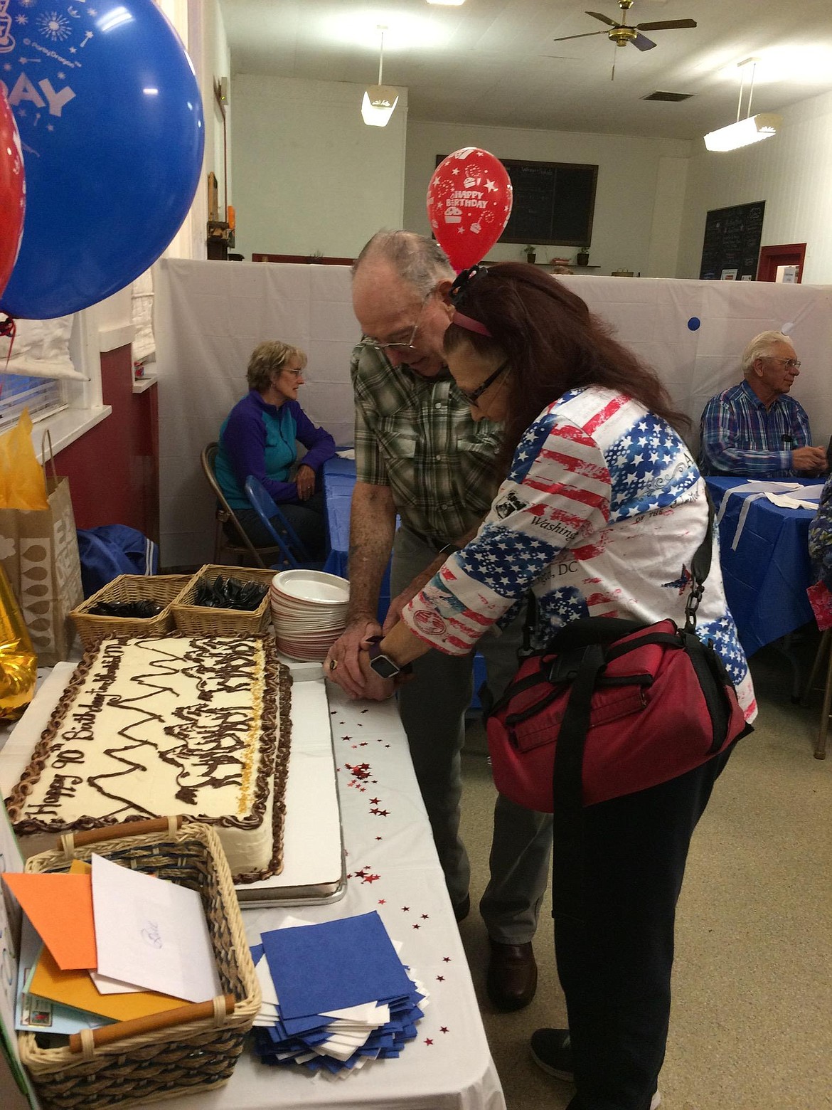 Bill and Joanie Merriman cut the cake to celebrate his 90th birthday on Oct. 5 at Whipped Up! in Superior. (Photo courtesy of Joanie Merriman).