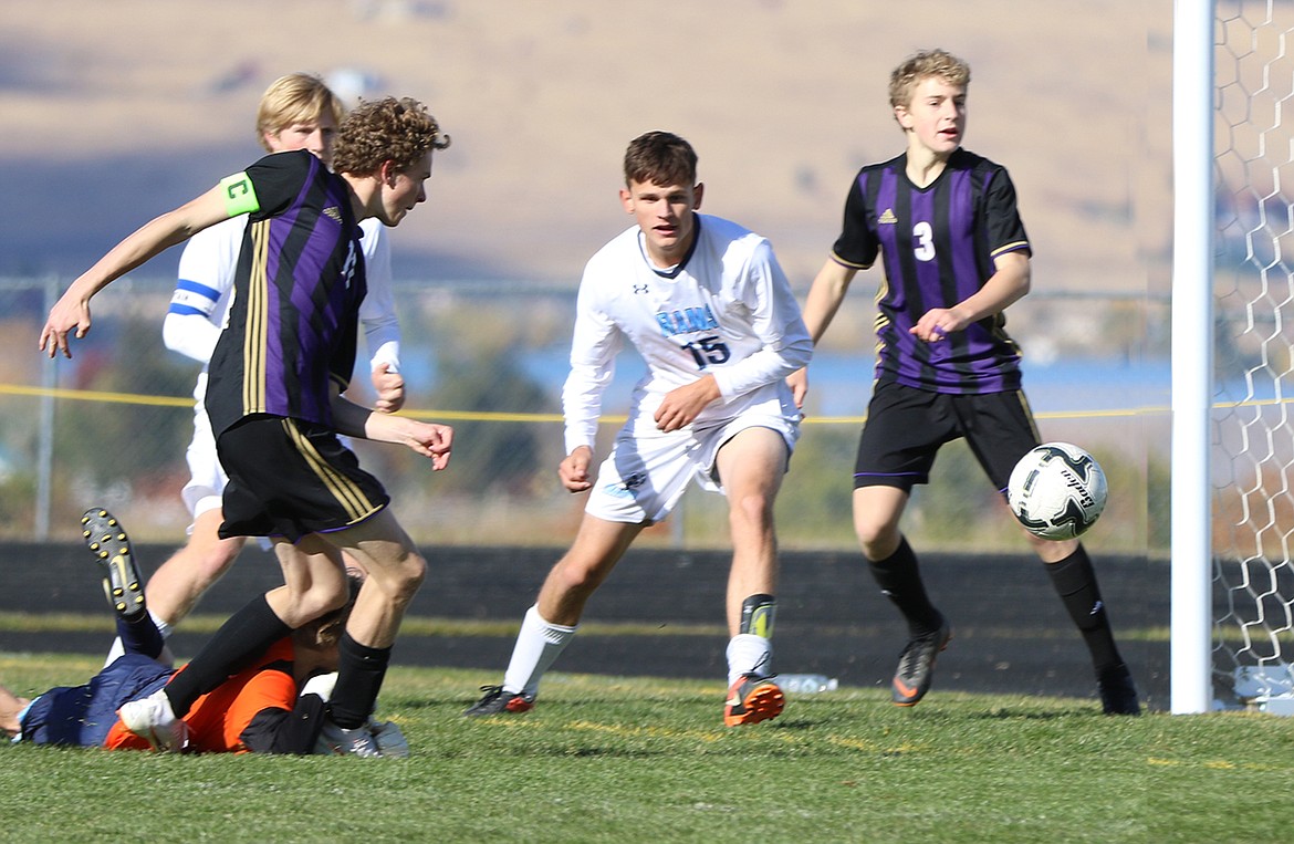 Polson&#146;s Robin Erickson beats the Loyola keeper and scores during last Saturday&#146;s first-round Class A State Playoff soccer match in Polson. Nico River (3) of Polson is in the background. (Bob Gunderson for the Lake County Leader)