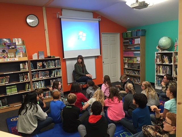 Mrs. Julie Colson educating students in our new library.