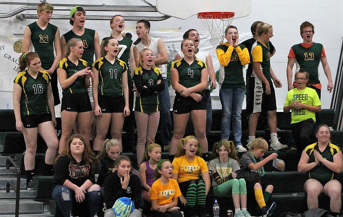 LEFT, St. Regis students cheer on the junior varsity volleyball girls during Homecoming on Oct. 9.