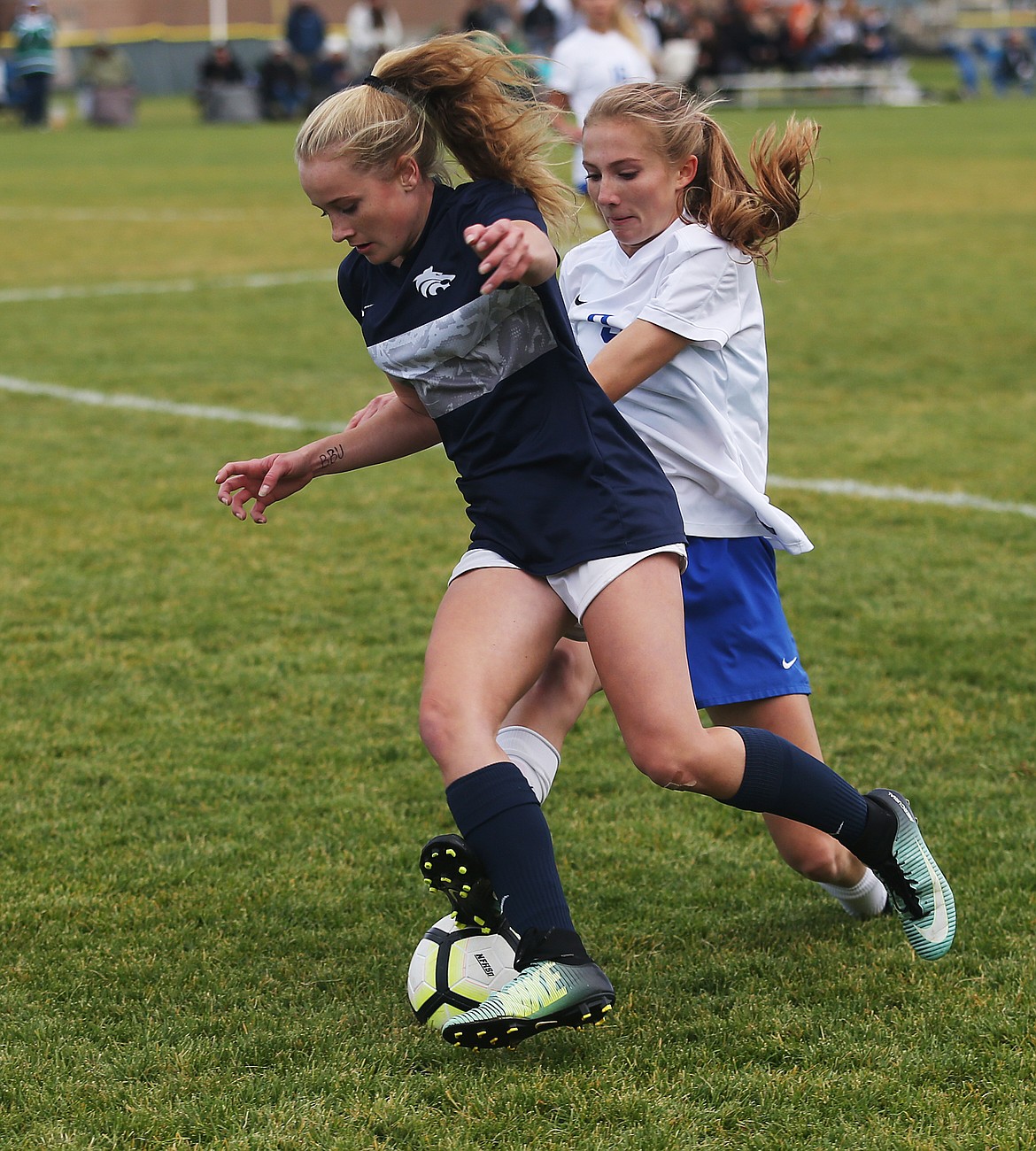 Lake City's Sammie Veare and Coeur d'Alene's Zoe Cox fight for the soccer ball in Tuesday's Region 1 girls championship game at Lake City High School. (LOREN BENOIT/Press)