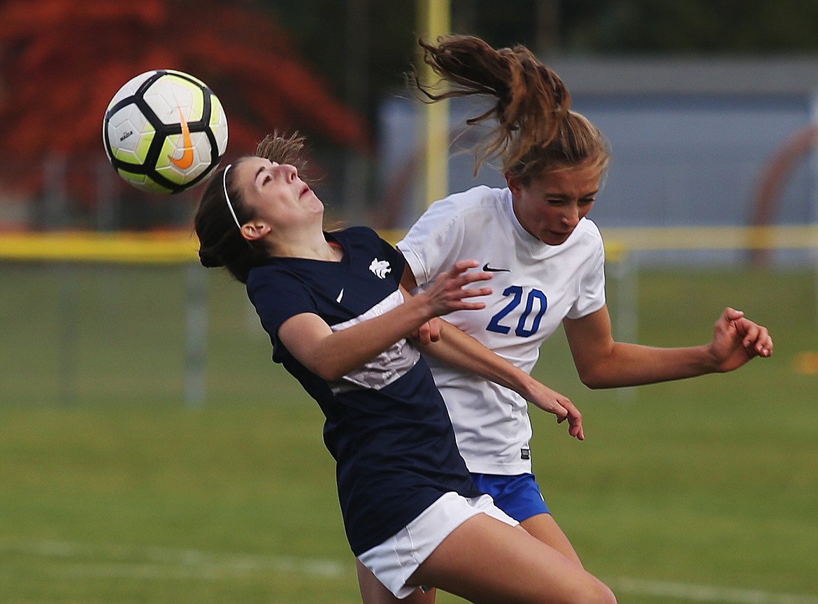 Lake City&#146;s Madyson Smith, left, and Coeur d&#146;Alene&#146;s Myah Rietze collide in the air in the Region 1 girls soccer championship game on Tuesday at Lake City High School. (LOREN BENOIT/Press)