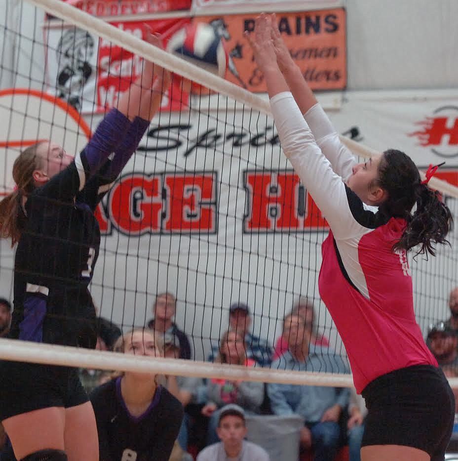 Charlo&#146;s Teaira Truman (3) goes up against McKennzie Cannon (13) of Hot Springs during last Saturday&#146;s match at Hot Springs. The Lady Vikings stayed undefeated with a four-set win over the Lady Savage Heat. (Joe Sova photos/Lake County Leader)