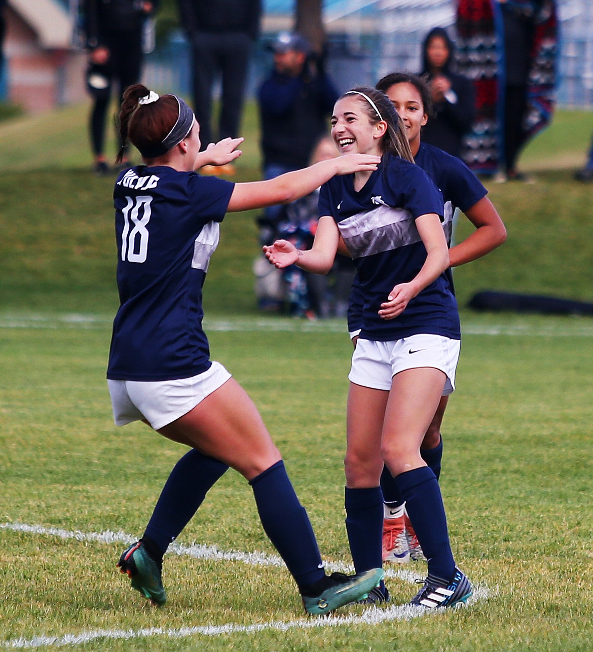Lake City's Madyson Smith celebrates her goal with Hannah Clarke (18) in Tuesday's Region 1 girls championship game at Lake City High School. (LOREN BENOIT/Press)