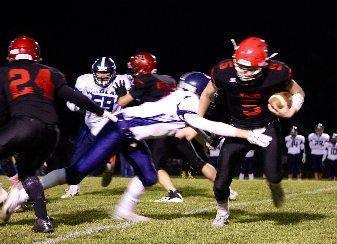 Photo by Chanse Watson/
Wallace player Logan Hull looks to evade a Lapwai defender during the Miners&#146; loss to Lapwai last week.