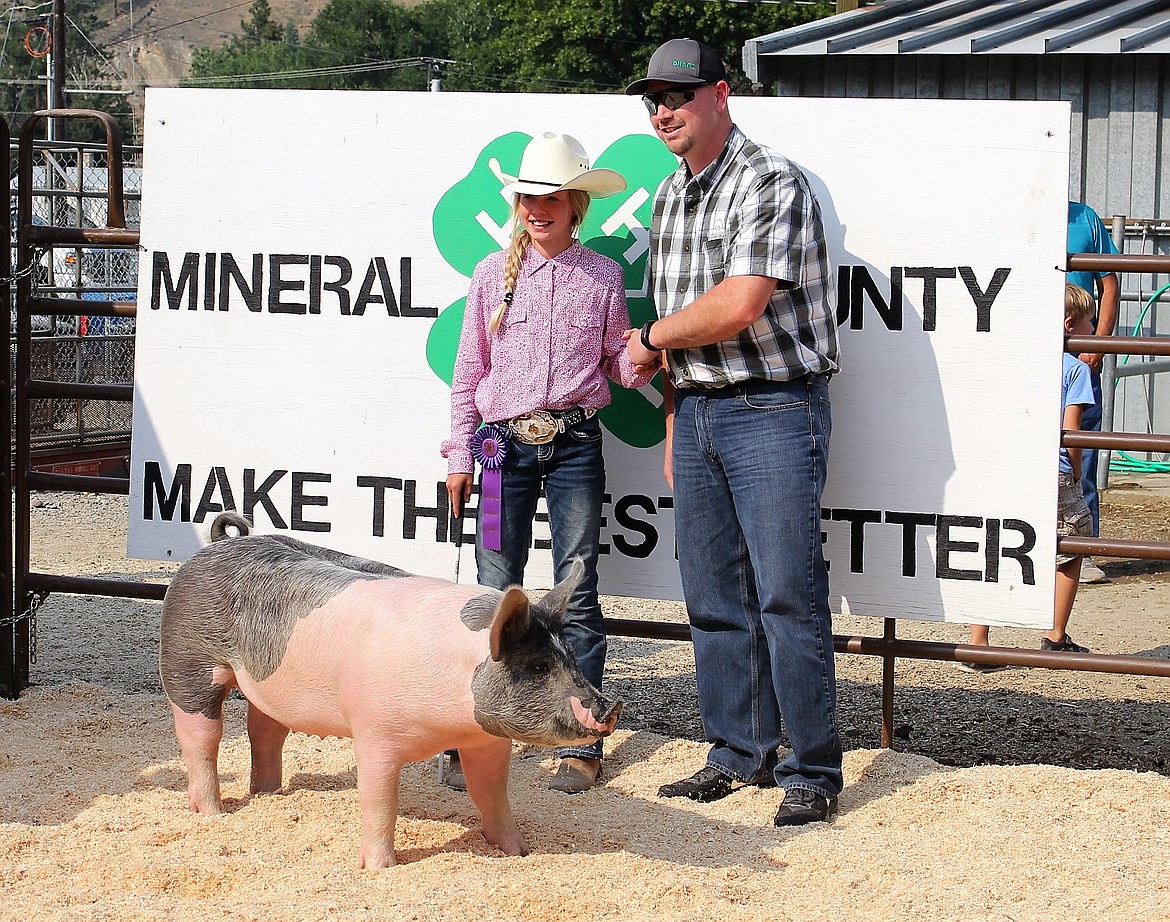 Heather Haskins, photographed here with IFG during last summer&#146;s 4-H livestock auction, received the Symbol of Excellence award for superior pork products from the Montana Pork Producers Council and MSU Extension. (Kathleen Woodford/Mineral Independent)