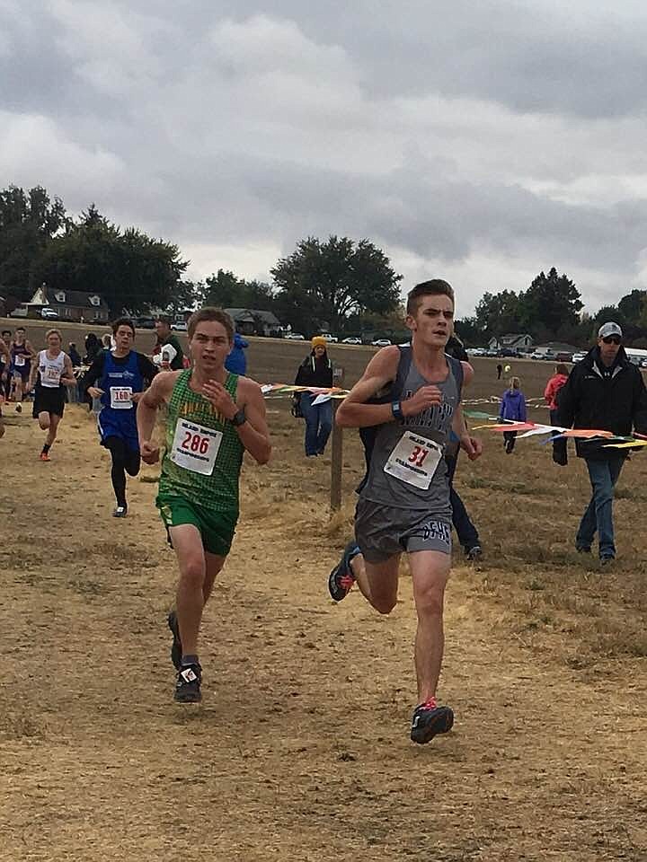 Photos by ELLEN SMITH
Hunter Smith and Madi McIntyre compete for the Badgers cross country teams on Oct. 6 at Lewiston Orchards in Lewiston, Idaho.