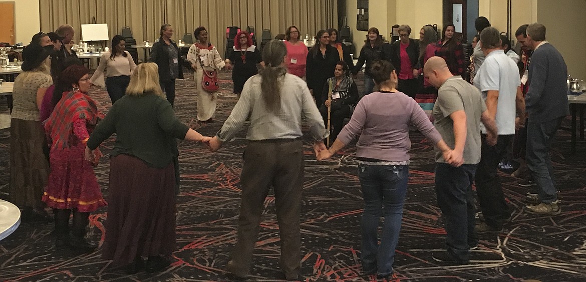 Participants of the Education and Research Symposium of the American Indigenous Research Association join in a round dance Saturday, Oct. 13 at the KwaTakNuk. (Ashley Fox/Lake County Leader)